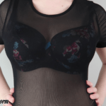 Busty girl in bra with mesh crop top shirt